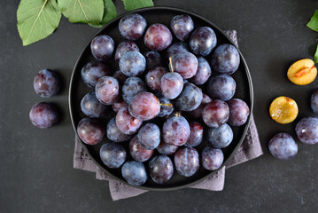 Fresh plums on plate