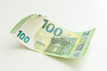 burnt bills of euro on white background closeup