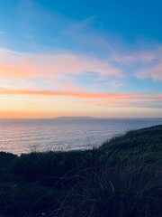 Beautiful colorful sky after the sunset at the sea coast, natural colors, sunset seascape background