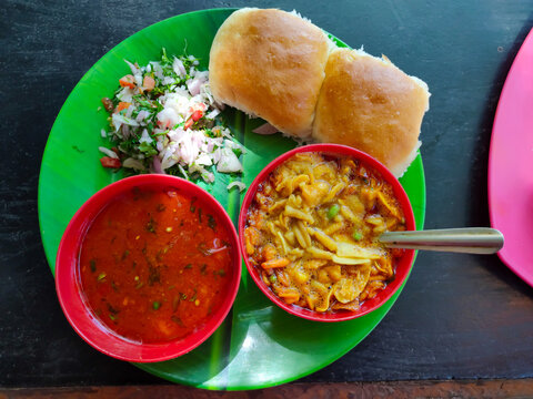 Spicy Misal Pav or usal Pav is a traditional snack or Chaat food from Maharashtra, India. Served with chopped onion, lemon