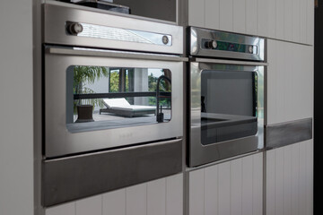Built-in stainless steel oven in Large luxury kitchen