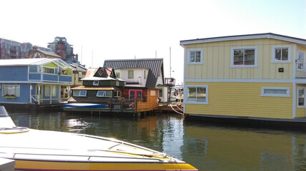 Fototapeta na wymiar Floating houses are in a harbor on a sunny day