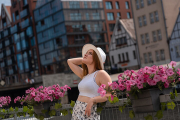 Fototapeta premium girl in a white hat on the background of the city of Gdansk Poland Europe