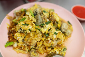 Omelette with oyster in Thai cafe in Chinatown, Bangkok