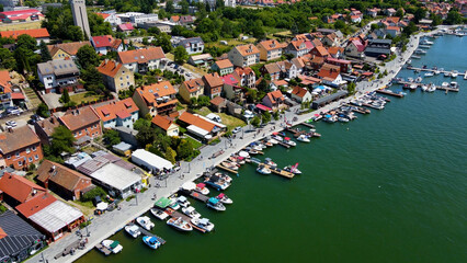Panoramic aerial photo from drone to Mikolajki townscape - capital of Masurian region on the shore...