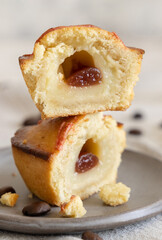 Pasticciotto leccese pastry filled with egg custard cream and sour cherry jam on a plate