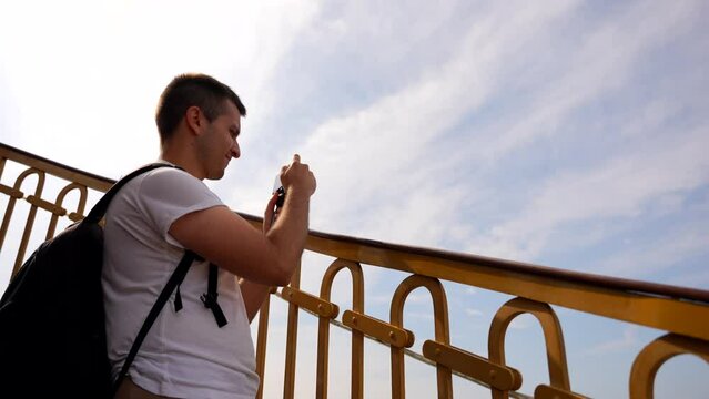 Man taking photos from spiral staircase of Vor Frelsers Church in Copenhagen, Denmark
