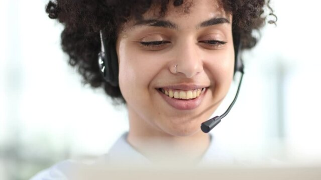 girl in a modern office working in a call center smiling