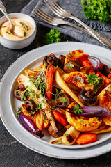 baked winter veggies and mushrooms on a plate