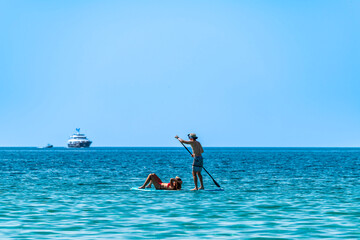 Stand Up Paddle at the sea, Corsica, France - obrazy, fototapety, plakaty
