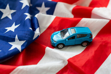 Reflection of American flag in the headlight of a classic car on route 66 america's iconic highway