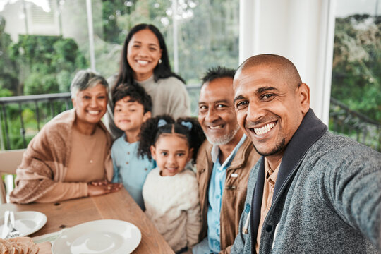 Family, portrait and smile for selfie at lunch, dinner or celebration together at home. Happy generations of kids, parents and grandparents in profile picture, quality time or reunion at dining table