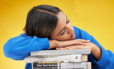 Woman, student and sleeping with books in studio with burnout, financial education and tired by...