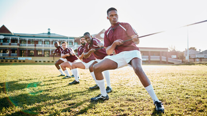 Sports, teamwork and tug of war, men at fitness training and practice for competition or game on...