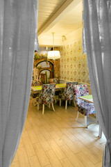 Interior of cozy living room in restaurant - table for four guests