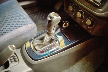 Car shift lever. Inside a modern car view, city car interior background