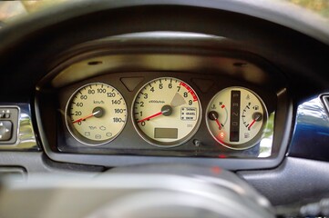 Car steering wheel and car sensors, inerior background, modern city car elements close view. Car...