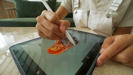 Digital artist draw pc tablet close up. Designer paint red head girl pic. Illustrator use ipad stylus pen. Pad user develop art skill. Person make work app. Hand hold color pencil. Woman game logotype