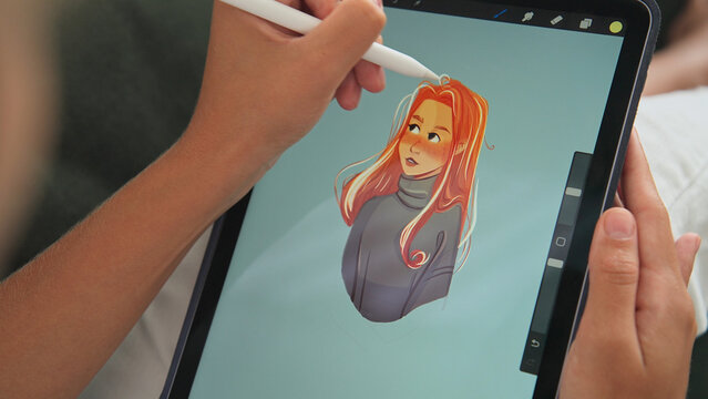 Digital artist draw pc tablet close up. Designer paint red head girl pic. Illustrator use ipad stylus pen. Pad user develop art skill. Person make work app. Hand hold color pencil. Woman game logotype