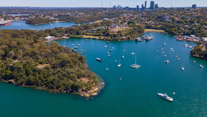 Fototapeta premium Aerial drone view of Berrys Bay and Balls Head Reserve at Waverton on the lower North Shore of Sydney, New South Wales, Australia on a sunny day 