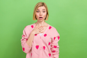 Photo of attractive young woman touch chest terrified wear trendy pink strawberry print clothes isolated on green color background