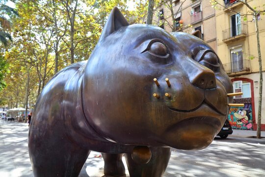 BARCELONA, SPAIN - OCTOBER 8, 2021: Public space cat monument in Barcelona, Spain. The Cat by artist Fernando Botero is located in Rambla del Raval public street.