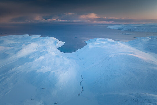 Arctic Splendor: Norwegian Fjords Aerial Winter Sunset in Mehamn