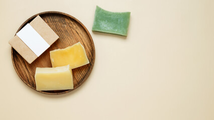 Natural eco-friendly soaps with different additives and soap in a mock up package