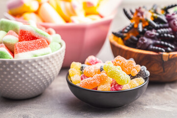 Sweet jelly candies in bowls.
