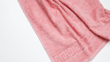 Soft and fluffy bath towel on white background. Top view, flatlay, copy space