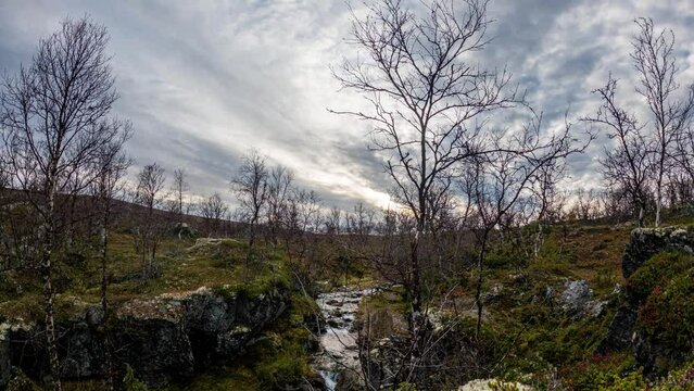 Time Lapse - Arctic stream and sun set in the wilderness.