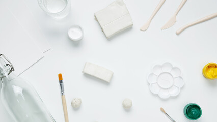 Hobby modeling from clay, tools and accessories for crafting on white background