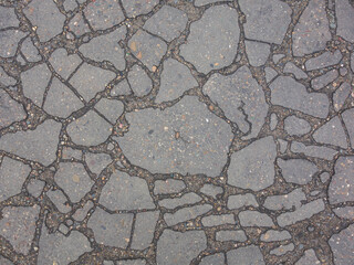 Old asphalt with many cracks