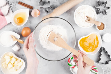 Cooking Christmas gingerbread. Woman baking holiday cookies. Top view