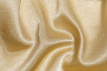 Obraz premium crumpled and wrinkled gold or yellow fabric texture close-up. background for your design