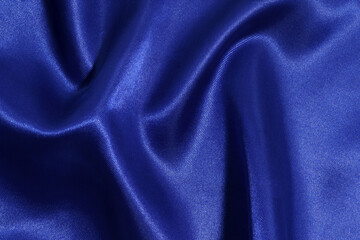 texture of beige fabric flowing close-up. material for sewing dresses, blouses. image for your mockup