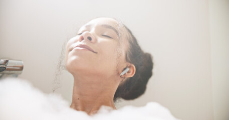 Music, face or happy woman in a bath in hotel cleaning, grooming or body care in soap foam. Relax,...