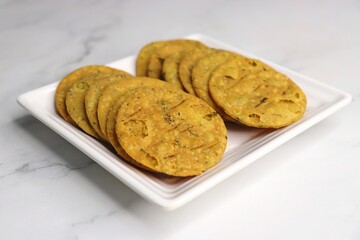Crispy and crunchy methi mathri is a popular tea time snack in northern parts of India. It's especially popular during the Diwali festive season. It's a savory cracker made using Maida and Fenugreek. 