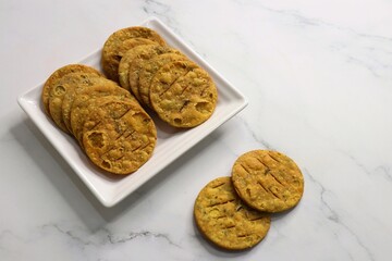 Crispy and crunchy methi mathri is a popular tea time snack in northern parts of India. It's especially popular during the Diwali festive season. It's a savory cracker made using Maida and Fenugreek. 