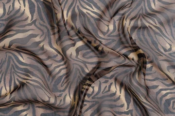 Stoff pro Meter texture of transparent chiffon fabric of leopard or tiger color. Image for your design. materials for sewing © Daryna 