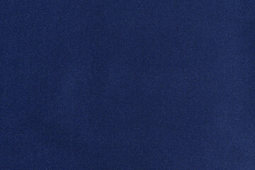 texture of twill fabric with blue glitter made of polyester. The concept of fabric for sewing....