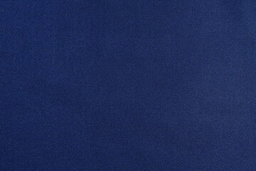 Close-up texture of twill and polyester fabric of blue color. The concept of fabric for sewing....
