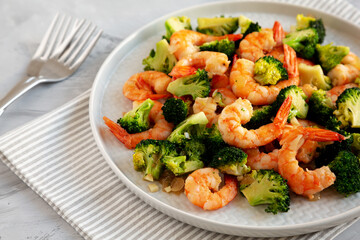 Homemade Garlic Broccoli Shrimp Stir Fry on a Plate, side view.