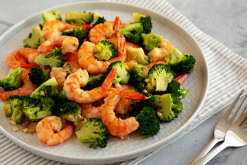 Homemade Garlic Broccoli Shrimp Stir Fry on a Plate, side view.