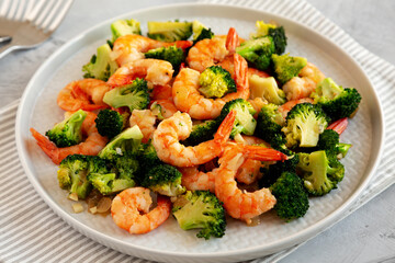 Homemade Garlic Broccoli Shrimp Stir Fry on a Plate, side view.