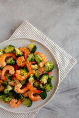 Homemade Garlic Broccoli Shrimp Stir Fry on a Plate, top view. Space for text.