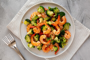 Homemade Garlic Broccoli Shrimp Stir Fry on a Plate, top view. Flat lay, overhead, from above.