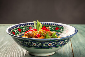 Uzbek pilaf or plov from lamb. Restaurant menu, dieting, cookbook recipe top view