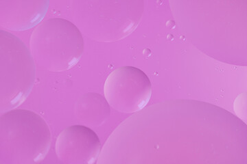 Top view oil bubbles drop on the water with colorful background, Macro photography concept