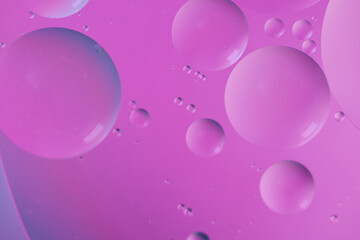 Top view oil bubbles drop on the water with colorful background, Macro photography concept